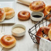 Assorted Bagels with bowls of sesame and poppy seed