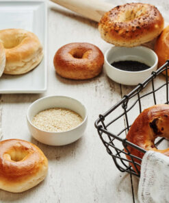 Assorted Bagels with bowls of sesame and poppy seed