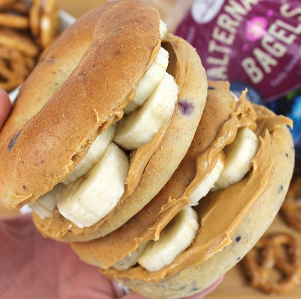 Blueberry Bagels with Banana and Peanut Butter. 